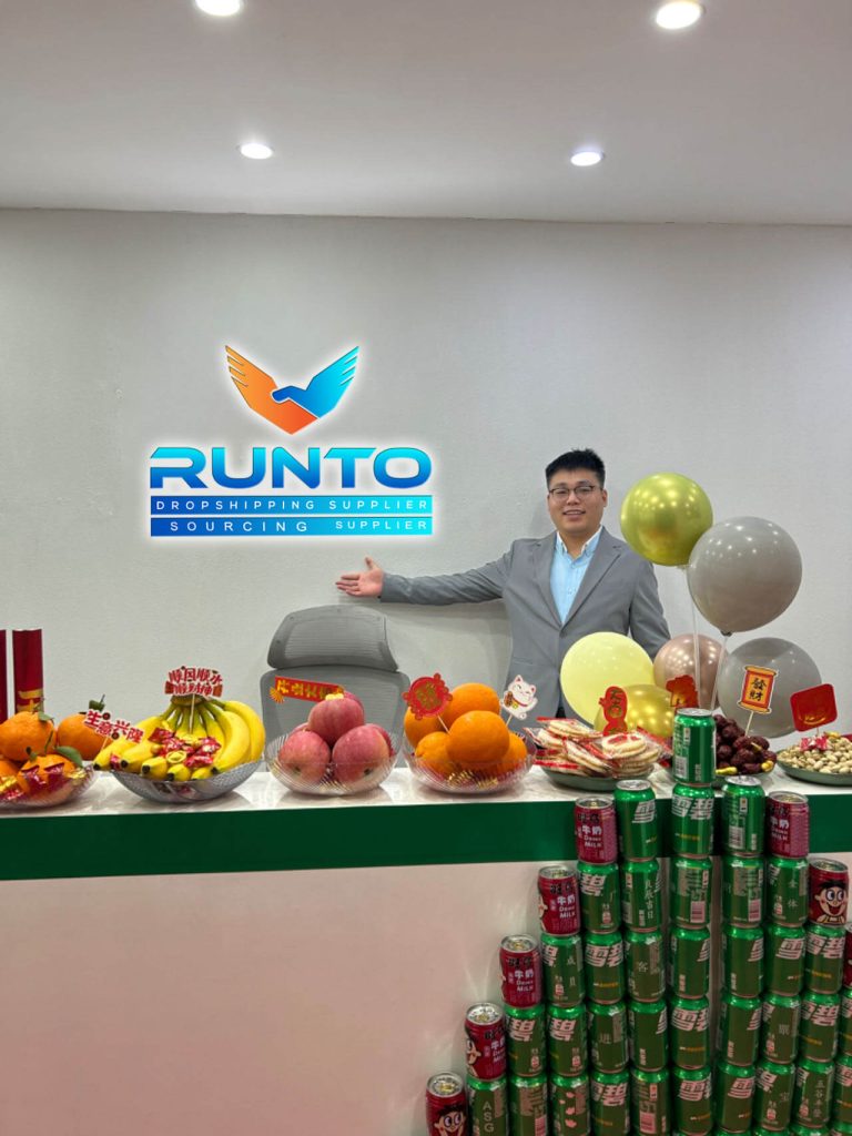 Founder in Runto office with festive decorations, fruits, and drinks.