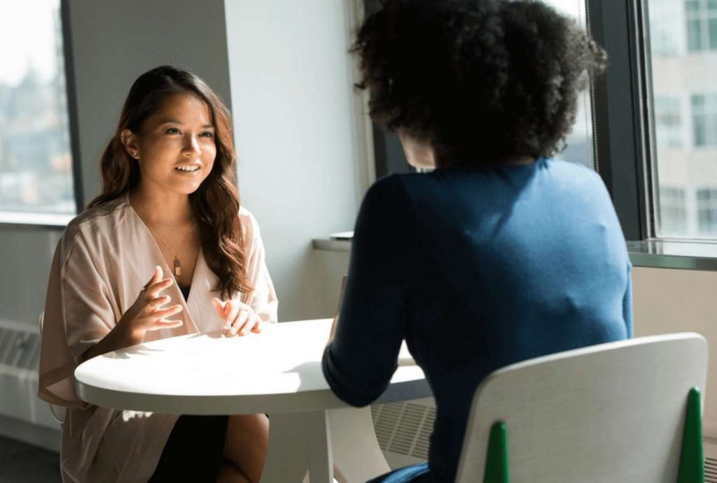 Business professionals negotiating supplier partnership terms for sustainable dropshipping operations
