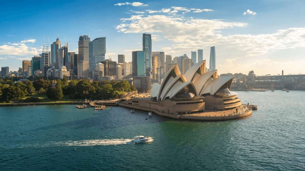 Scenic view of Sydney Harbour and Opera House in Australia, used as featured image for article about the cheapest way to ship to Australia